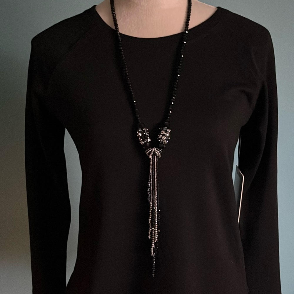 Black beaded Necklace 25” long with knotted detail & 7”drop. No clasp